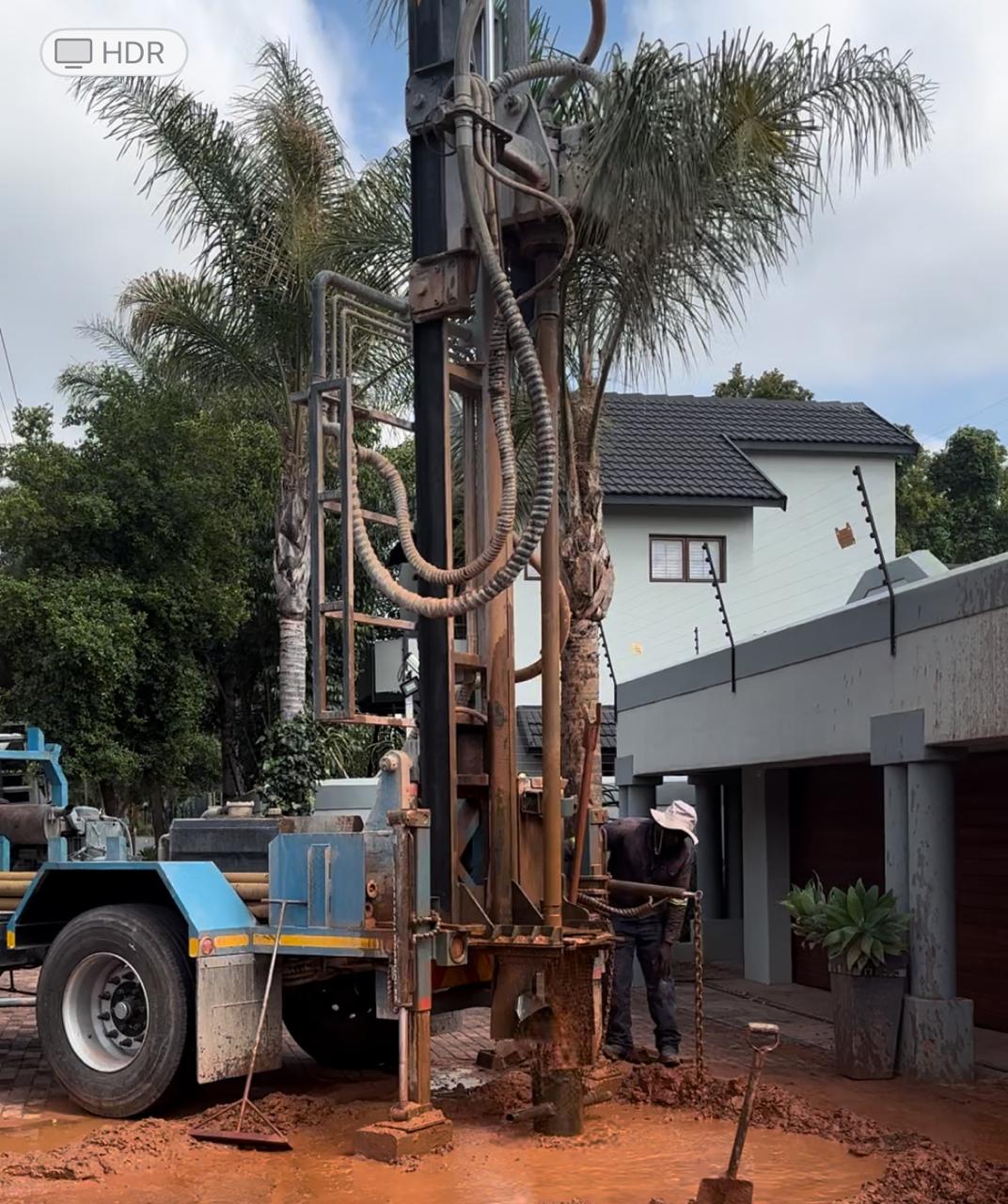 Borehole drilling rig operating on-site